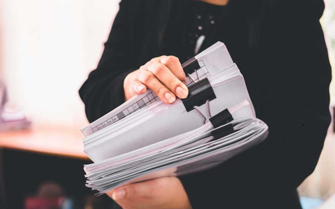 Woman working on paper documents