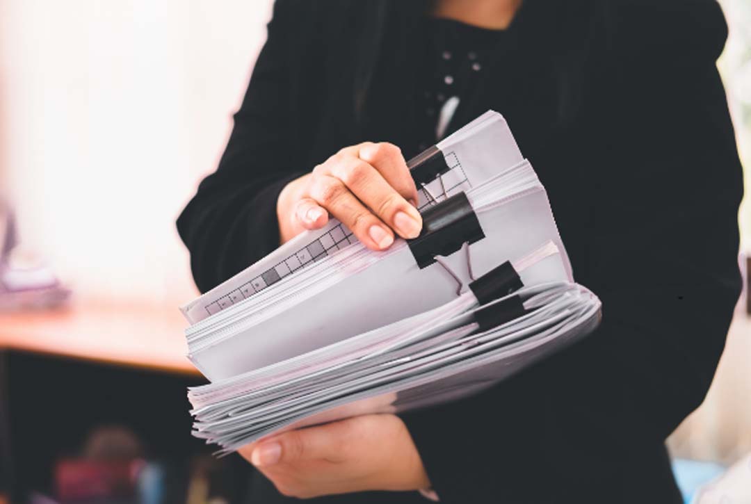 Woman working on paper documents